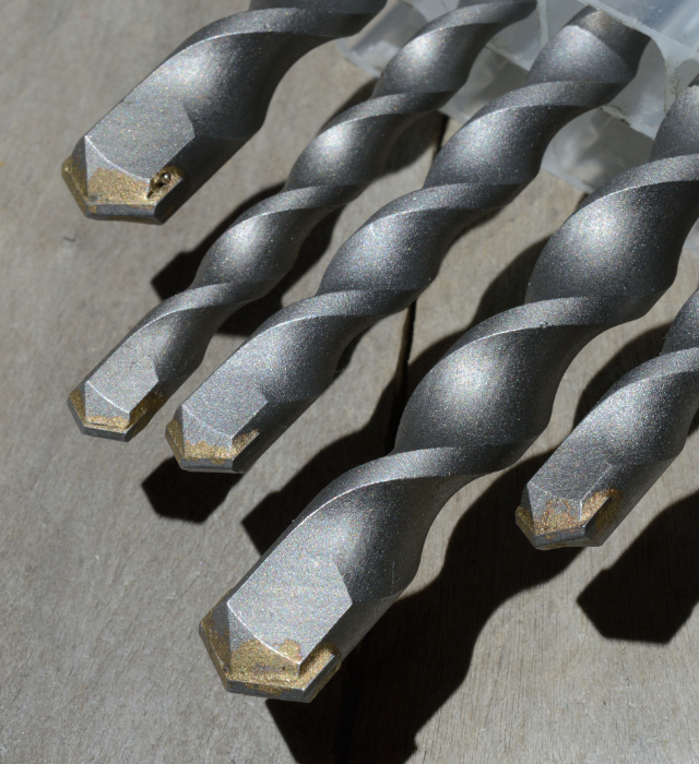 knowing what drill bit to use when drilling through a porcelain tile is important like these carbide tipped bits